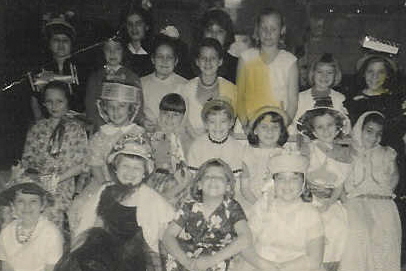 Kathy as a child with her brownie troop