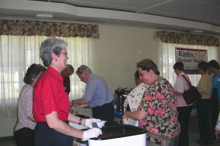 Friends of Kathy Reiner Martin volunteer Anita Obinger serving up chili at the "Chili for Change" fundraiser