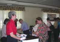 Friends of Kathy Reiner Martin volunteer Anita Obinger serving up chili at the "Chili for Change" fundraiser