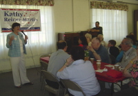 Kathy speaking at the "Chili for Change" fundraiser